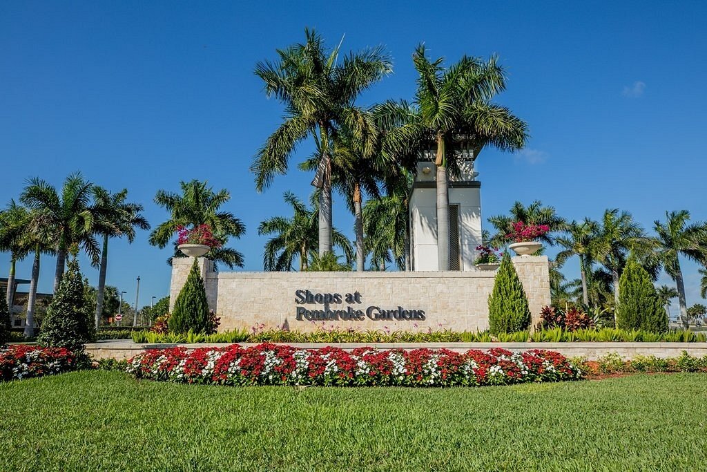 Shops at Pembroke Gardens with palm trees and blue sky